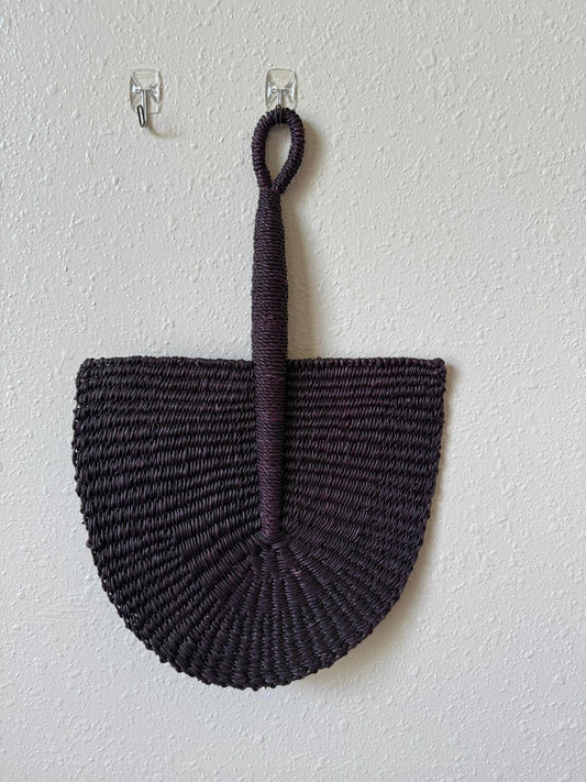 A hand-woven African fan